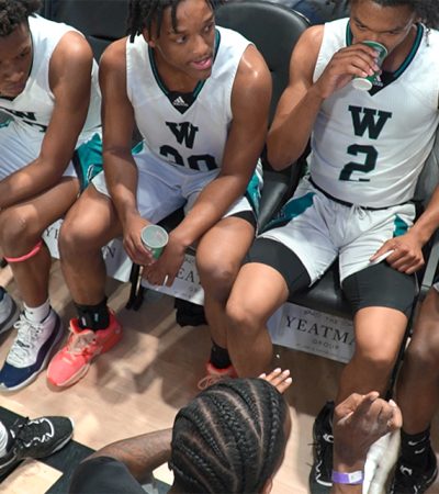 Woodside Wolverines sideline erupts after the final seconds ran out at the VCU Siegel Center in Richmond, Virginia.